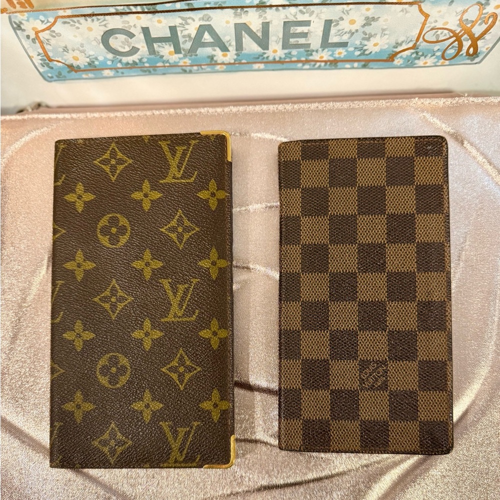 Bundle of two vintage Louis Vuitton Brazza wallets.